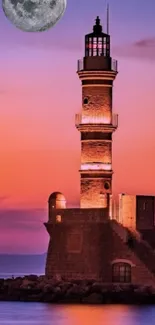 Lighthouse at dusk with a full moon and a purple sunset sky.