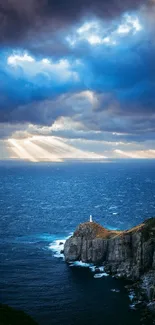 Lighthouse on a cliff with ocean view under a dramatic, cloudy, and colorful sky.