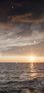 Lighthouse illuminated at sunset over a calm ocean horizon.