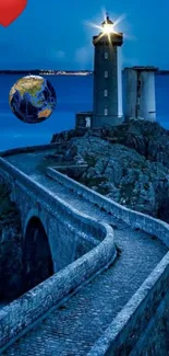 Lighthouse illuminated under a blue night sky with a scenic coastal path.