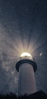 Lighthouse silhouetted against a starry night sky, casting a radiant glow.