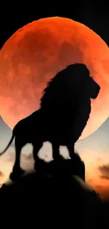 Lion silhouette with red moon in background.