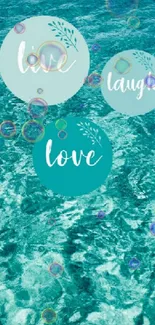 Live Laugh Love text on teal ocean background wallpaper.