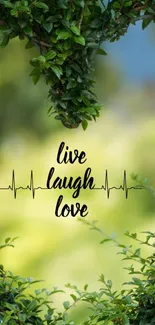 Live laugh love quote on green leafy background wallpaper.