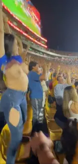 Vibrant crowd celebrating in a stadium at night.