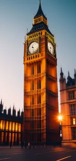 Big Ben glowing at dusk with a vibrant orange hue.