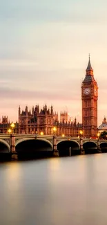 London skyline with Big Ben at sunset reflecting over Thames River.