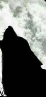 Wolf silhouette howling at full moon.