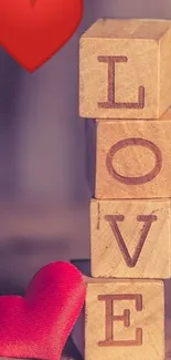 Mobile wallpaper with LOVE wooden blocks and heart.