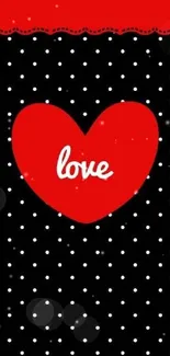 Red heart on black polka dot wallpaper with a love theme.