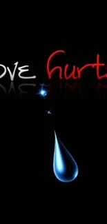 Love hurts text with blue droplet on black background.