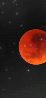 Red lunar eclipse with stars in the night sky.