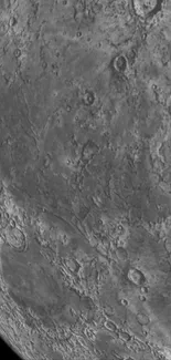 Close-up lunar surface wallpaper showcasing moon's craters and rock formations.