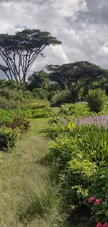 Lush garden wallpaper with vibrant flowers and trees.