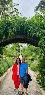 Serene garden path with lush greenery and a rustic archway.