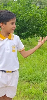 Child in a lush green garden, enjoying a sunny day.