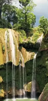 Lush green waterfall cascading down in a verdant forest setting.