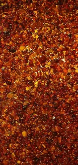 Amber gemstones form a warm, textured mobile wallpaper background.