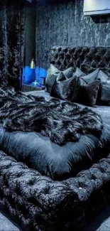 Luxurious black-themed bedroom with plush bedding.