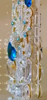 Luxurious phone case with blue gemstones and sparkling design.
