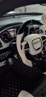 Luxurious car interior with sleek steering wheel design.