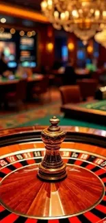 Luxurious roulette table with chandelier in a casino setting.