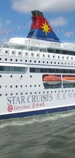 Luxurious cruise ship sailing on open sea with clear skies.