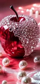 Luxurious crystal apple on pink background with pearls.