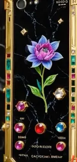 Luxury phone with floral design and gemstones.