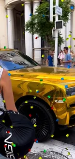 Luxurious gold car on a city street with colorful confetti.