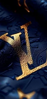 Luxurious gold monogram on blue leather background.