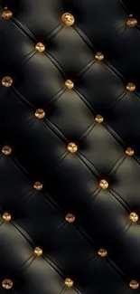 Luxurious black leather wallpaper with gold buttons.