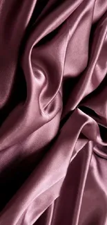 Luxurious purple silk fabric with elegant folds.