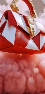 Luxurious red handbag floating in pink clouds.