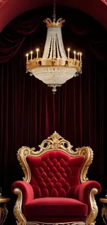 Luxurious red throne room with chandelier and ornate decor.