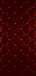 Luxurious red velvet wallpaper with tufted texture.