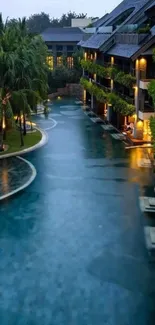 Luxurious resort pool surrounded by greenery and elegant architecture at dusk.