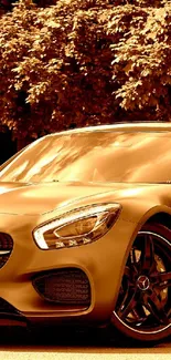 Luxurious sports car with a gold tint parked by trees.