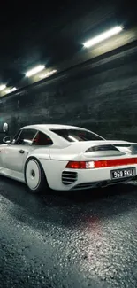 White sports car in tunnel at night, elegant and sleek.