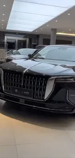 Luxury black sedan in a modern showroom, ideal wallpaper.