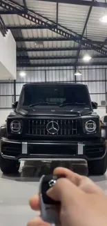 Luxury black SUV parked in a sleek, modern garage.