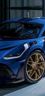 Luxury blue sports car with gold rims in a garage setting.