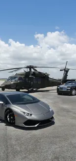 Luxury cars and helicopter on a runway with blue sky.