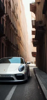 White luxury car on a narrow urban street.