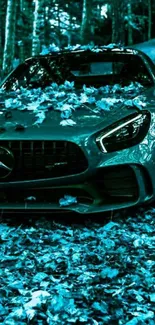 Teal luxury car with leaves in a forest setting wallpaper.