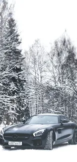 Black luxury car in snowy forest landscape, perfect for winter wallpapers.