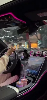 Luxury car interior with pink ambient lights and high-tech dashboard at night.