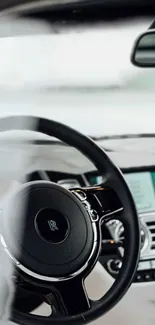 High-end luxury car interior with a sleek steering wheel.