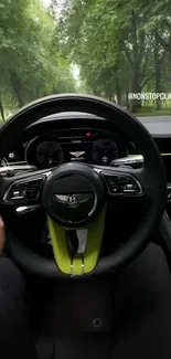 Luxury Bentley steering wheel with green backdrop.