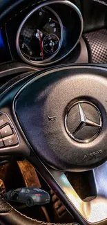 Mercedes-Benz steering wheel with luxury design in black and metallic tones.